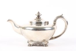 A George IV silver teapot, hallmarked London 1829, with scrolled handle and ivory spacers, supported