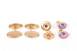 A pair of 9ct gold engine turned cufflinks and dress studs in a fitted box, together with a pair