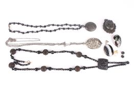 A collection of assorted jewellery, including two jet bead pendant necklaces, a white metal