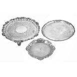 Three silver salvers, the first hallmarked London 1844 by Charles Reily & George Storer, the