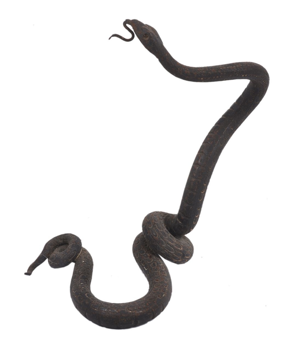 A bronze watch holder in the form of a snake, the coiled snake realistically modelled with projected