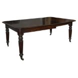 A Victorian mahogany dining table, with centre leaf, tapered moulded legs and castors, 228cm long,