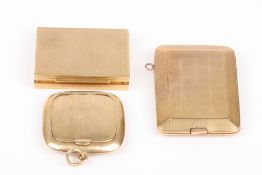 Three 9ct gold boxes, comprising an engine turned vesta case Birmingham 1926; an engine turned and