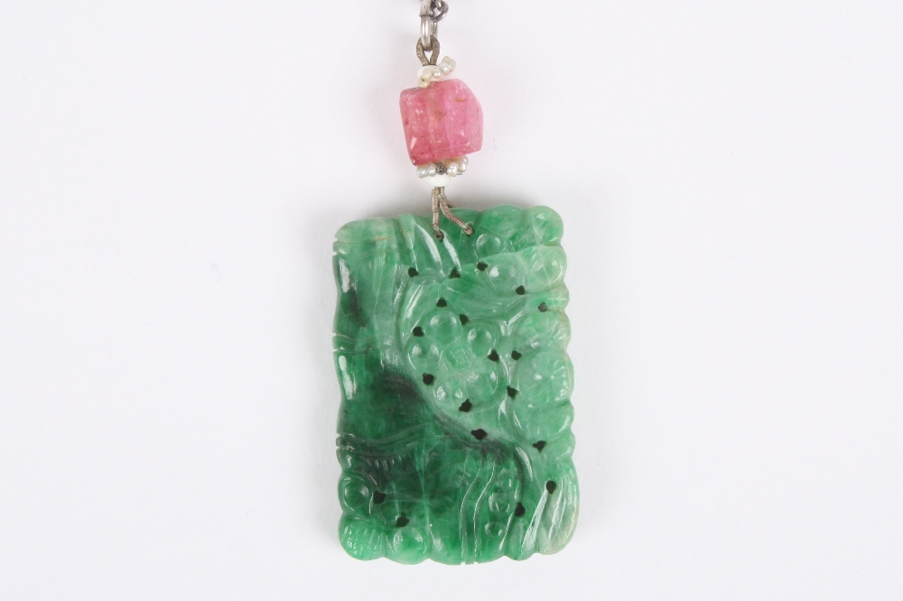 A Chinese jade pendant, of rectangular form carved on both sides with bamboo and flowers, the jade - Image 2 of 3