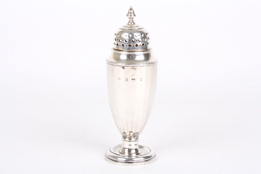 A silver shaker, hallmarked Birmingham, 1929 and mark for Selfridges & Co, height 16cm . With