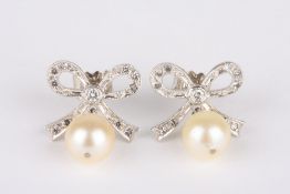 A pair of pearl and diamond earrings, formed as bows with pearls suspended below, with butterfly and