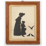 A large Victorian silhouette picture of a mother and child feeding the birds, together with an early