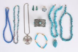 A collection of costume jewellery, including a hammered pewter cuff decorated with turquoise