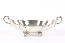 A large white metal lobed lozenge shaped hammered bowl, Continental, stamped 900, with twin scrolled