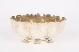 An Edwardian silver eight lobed petal bowl, hallmarked London 1902, with makers mark: CE,