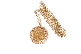 An Edwardian 1904 full sovereign pendant and chain, in a 9ct gold mount with 9ct chain. 20.1 grams