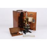 An E. Leitz Wetzlar monocular microscope, German, early 20th century No 97512, with rack and