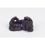 A Chinese miniature bronze, probably second half 20th century the resting dragon with two small