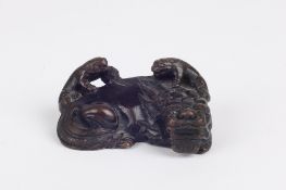 A Chinese miniature bronze, probably second half 20th century the resting dragon with two small