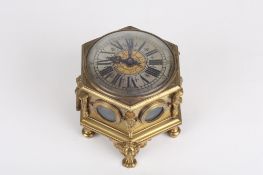An 18th century German brass hexagonal horizontal table clock, the silvered chapter ring with