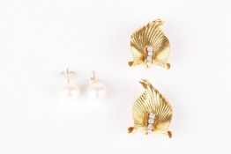 A pair of 18ct gold and diamond leaf shaped earrings, each set with a graduated row of diamonds,