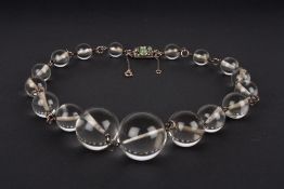 A rock crystal necklace attributed to Sybil Dunlop, formed as graduated rock crystal spheres, the