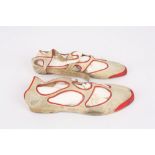 A pair of ladies 1920s rubber Silver Wing shoes, the cream shoes with red outline to cut-outs,