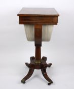 A Regency rosewood work table, with central drawer opening to reveal a fitted compartmented