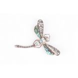 A Continental dragonfly brooch with abalone shell wings, and pale blue stone inset body, set in