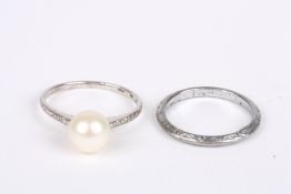 Two white metal rings, one set with a cultured pearl and stamped K9, the other unmarked and with