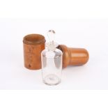 A late 19th century treen cased apothecary bottle and stopper, the finely turned fruitwood case with