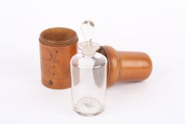 A late 19th century treen cased apothecary bottle and stopper, the finely turned fruitwood case with