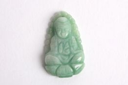 A carved Chinese jadeite pendant of a seated deity, of mottled pale green and white colour. 3.25cm