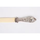 A Victorian silver and carved ivory page turner, hallmarked Birmingham 1891, the handle embossed