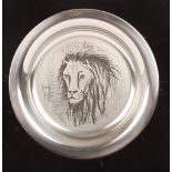 A 1976 Bernard Buffet silver plate decorated with a Lion, marked .925, in a fitted box with original