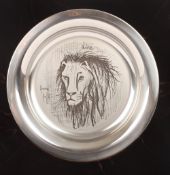 A 1976 Bernard Buffet silver plate decorated with a Lion, marked .925, in a fitted box with original