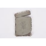 A Victorian silver card case, of shaped rectangular form, the front with interlaced initials,