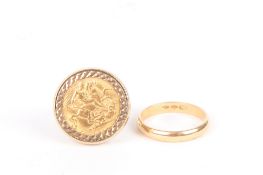 A 1915 half sovereign in a 9ct gold mount, and an 18ct gold wedding band stamped .750. (2). Band 3.9