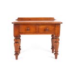 A Victorian apprentice writing desk, circa 1860 with two drawers to the front and turned baluster