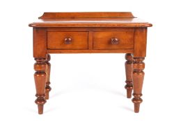 A Victorian apprentice writing desk, circa 1860 with two drawers to the front and turned baluster