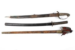 Three 19th century swords, comprising: a Victorian naval sword with gilded lion hilt and shagreen