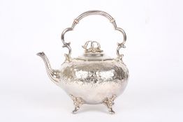 A Victorian silver plated teapot, with shaped handle and repoussé decoration of shells and