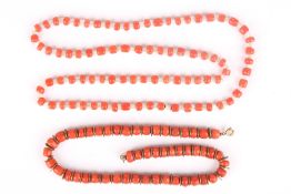 Two coral bead necklaces, one interspersed with metal discs, the other with glass rods . Good