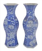 A pair of late 19th century Chinese blue and white vases, of hexagonal form, painted with a