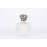 A large silver and glass Victorian perfume bottle, the bottle of globe shaped form with silver mount