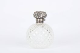 A large silver and glass Victorian perfume bottle, the bottle of globe shaped form with silver mount