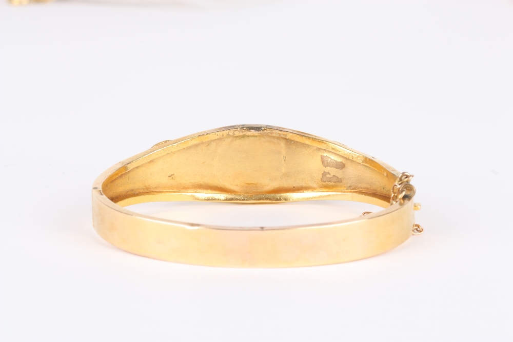 A Victorian yellow metal stiff bangle, set with three cabochon foil backed stones, the metal - Image 2 of 2