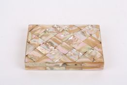 A late 19th century mother-of-pearl card case, opening up to reveal a silk lined compartmented