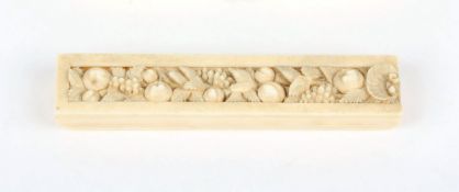 A carved ivory needle case, probably late 19th century of rectangular form with sliding lid finely