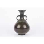 An early 20th century Chinese bronze vase, of bulbous form with mottled brown patina, the