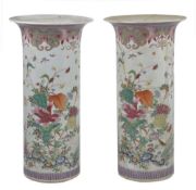 A pair of Chinese 18th century ‘famille-rose’ beaker vases, Yongzheng/Qianlong, each painted in rich