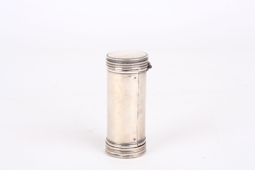 A white metal nutmeg grater, of cylindrical form, marked with makers initials IP, the cap lifts up