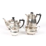 An Edward VII silver tea and coffee set, hallmarked London 1907, with makers mark for John Hunt,