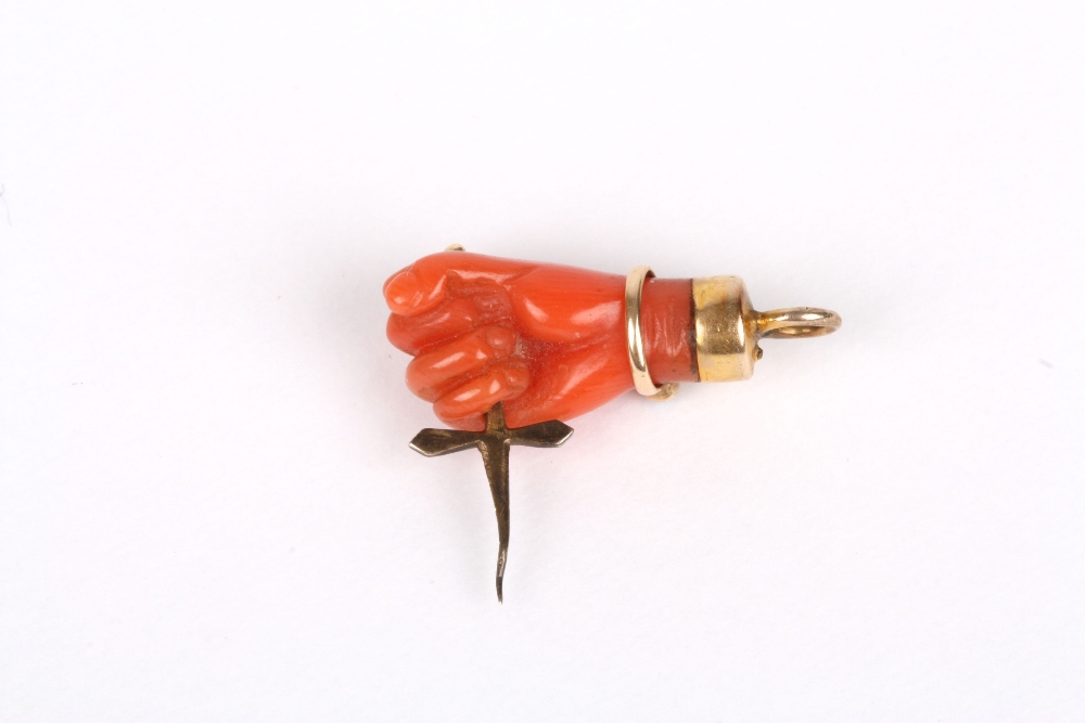 A Victorian carved coral charm, formed as a hand holding a dagger, with diamond and turquoise - Image 2 of 2