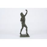 A patinated bronze figure of the Dancing Faun of Pompeii, the standing nude figure in mid stride on